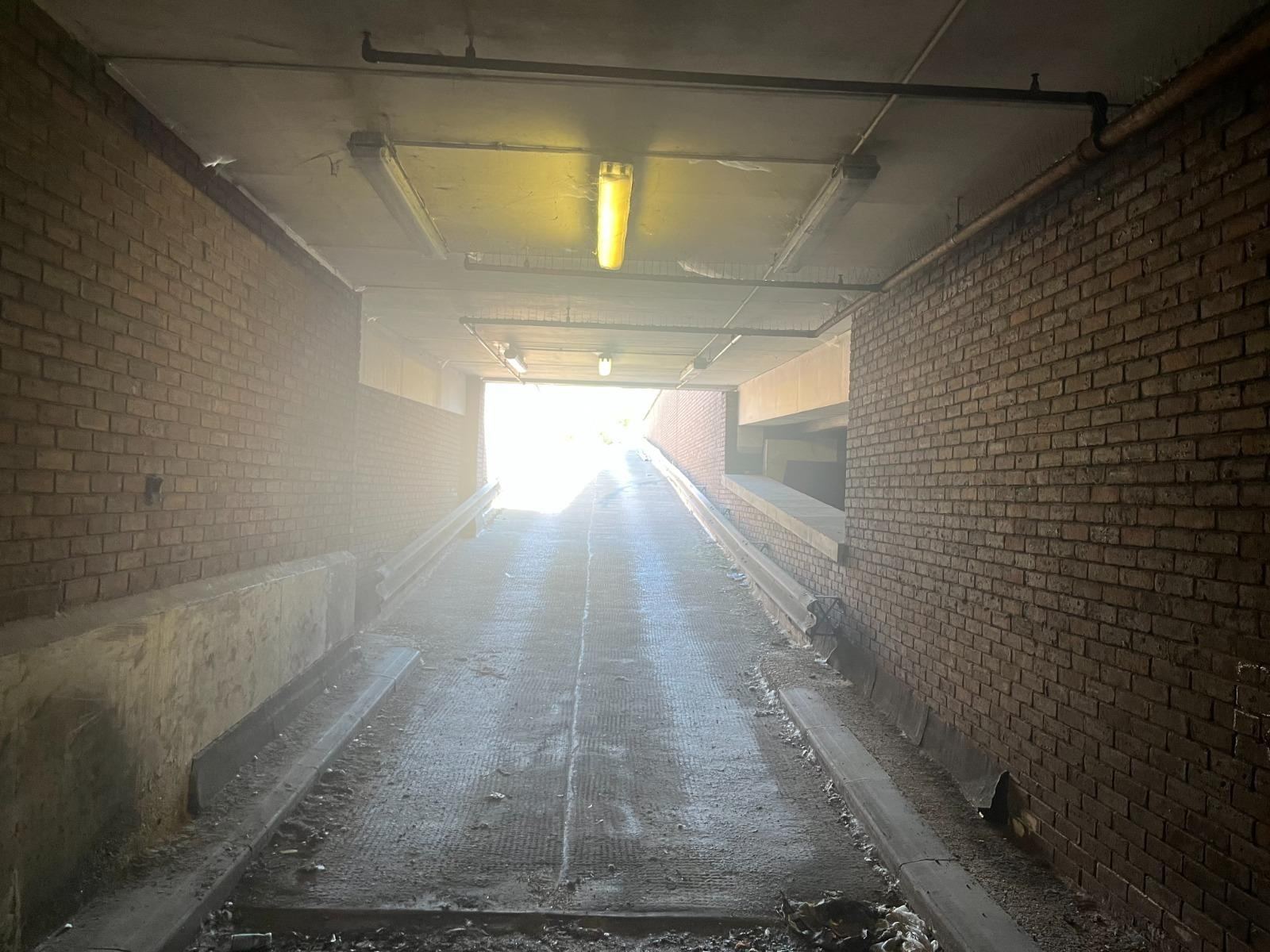 Car park access tunnel — open before board-up — LT Lockworks