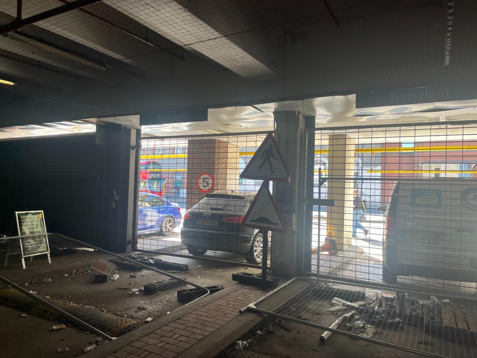 Car park entrance — vandalism and debris before board-up — LT Lockworks
