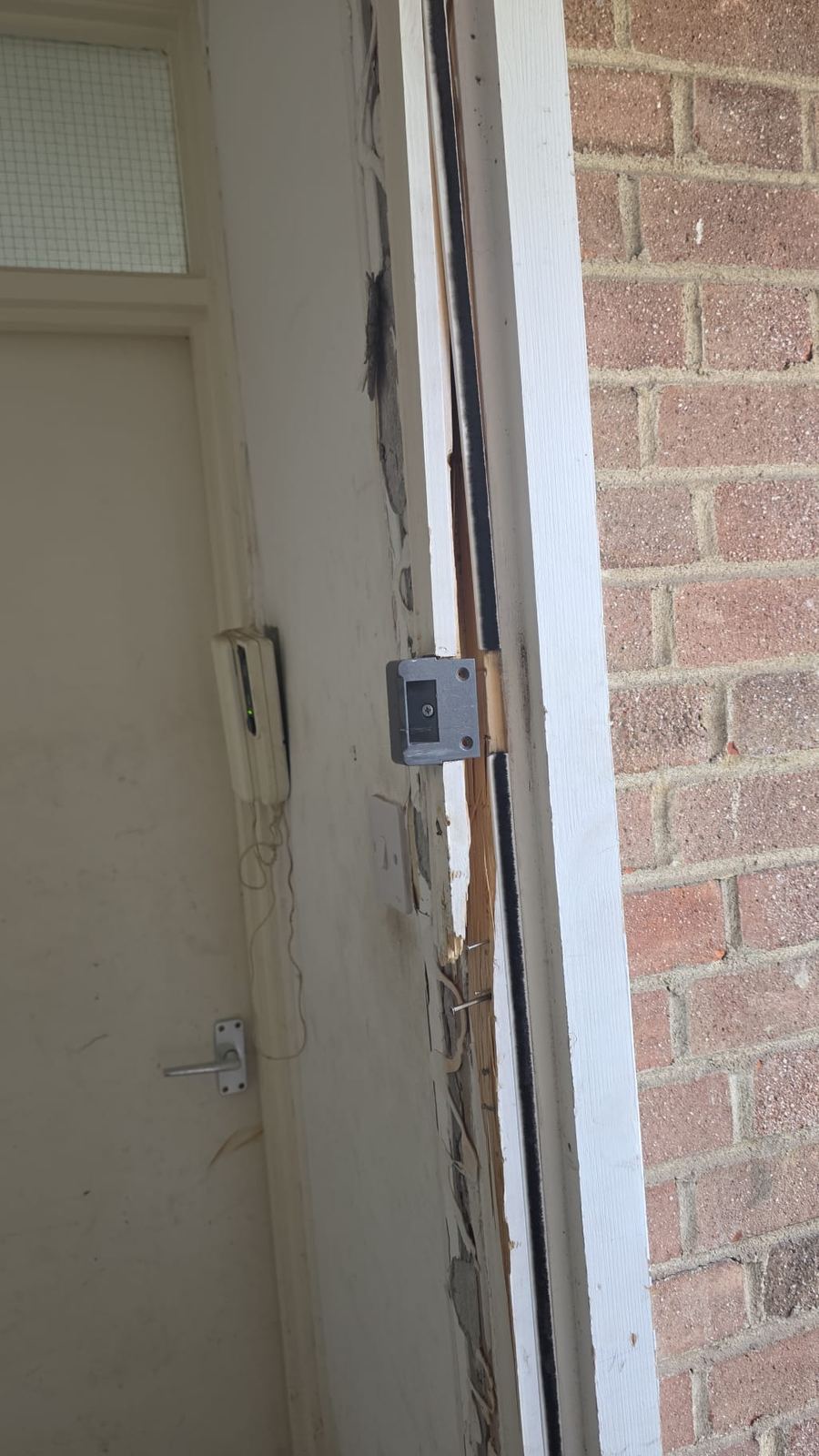Door frame damaged after burglary — LT Lockworks emergency reinforcement