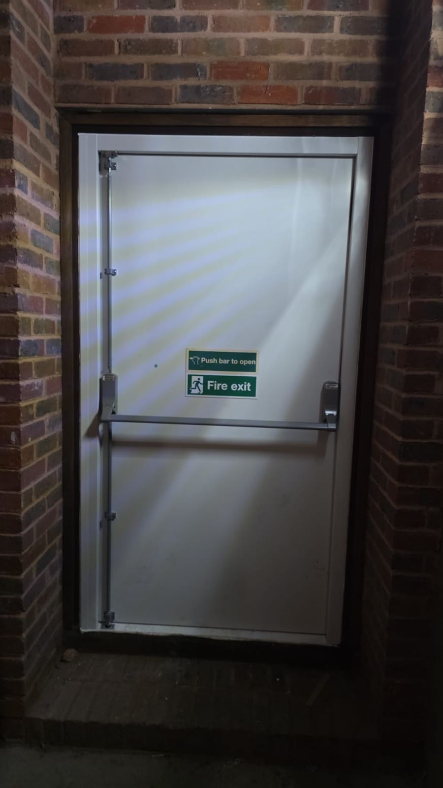 Fire exit push bar installed on commercial steel door by LT Lockworks London