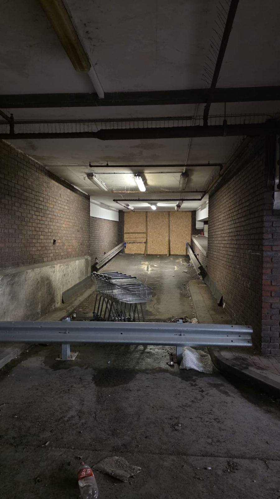 Inside car park ramp tunnel boarded up — LT Lockworks South London