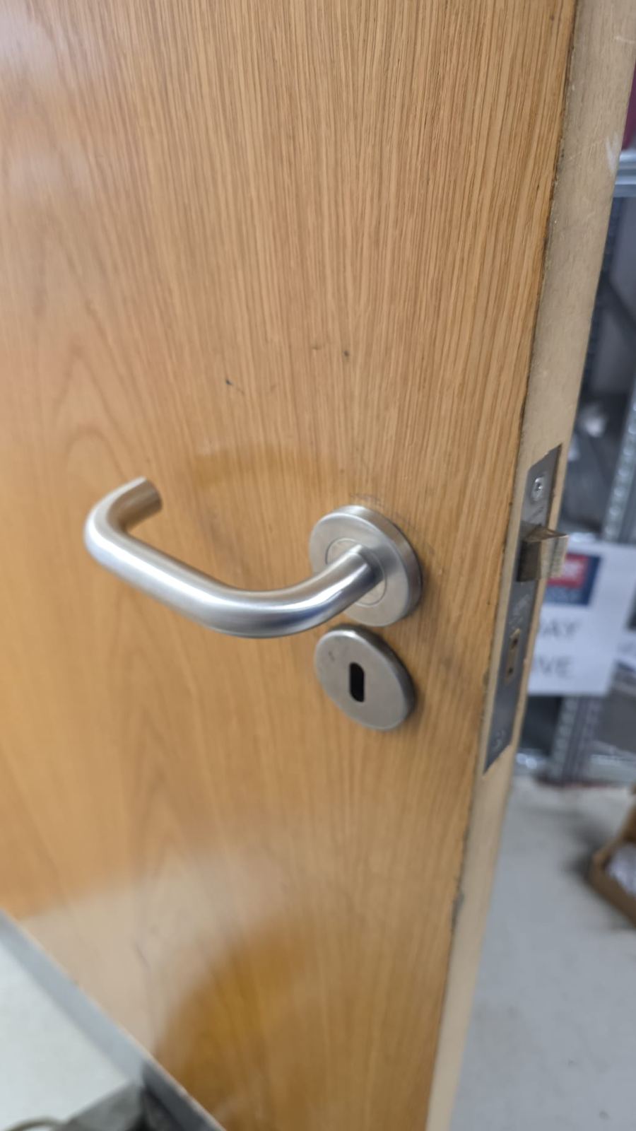 Sashlock with lever handle fitted to oak wooden door by LT Lockworks London